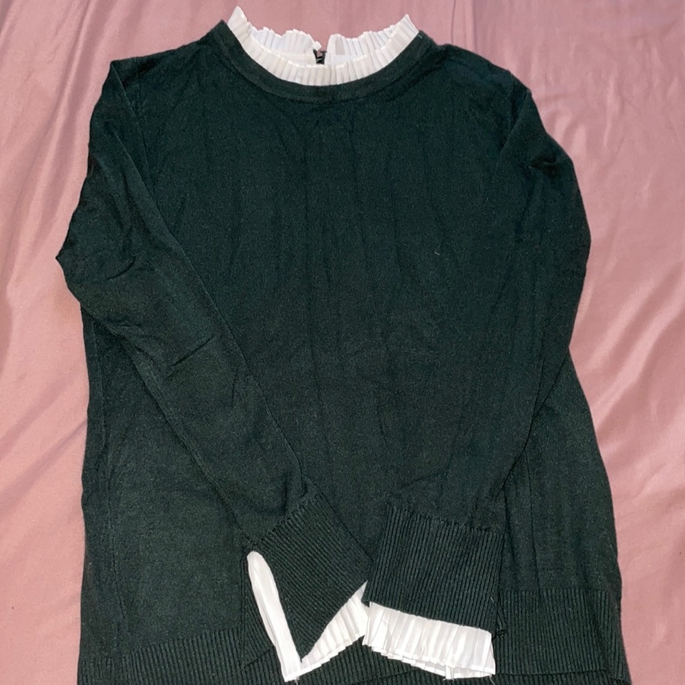 Green sweater with white collar